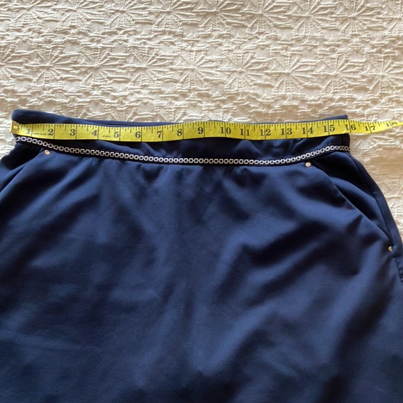 Great Greg Norman navy skort with navy and silver braid around waistband. - Picture 12 of 15